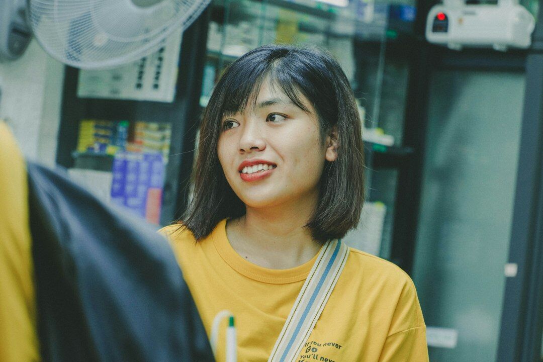 Friendly middle-aged woman coordinator smiling at the camera