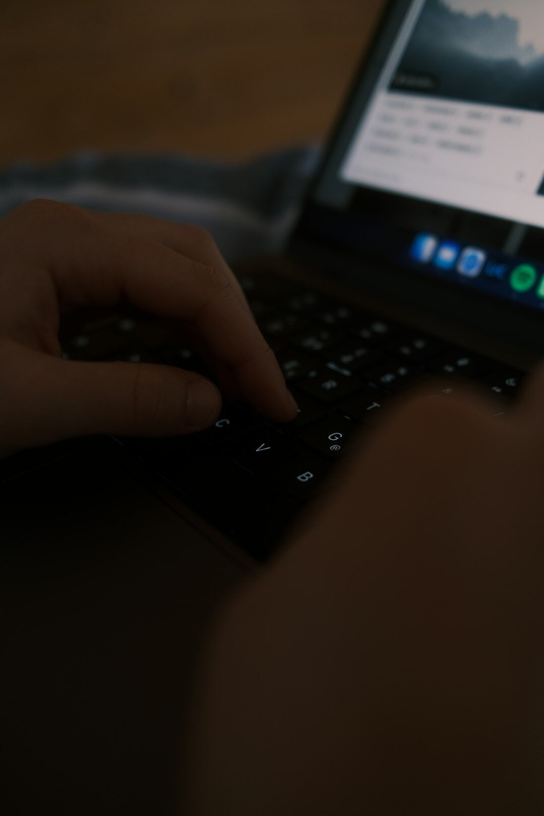 writer typing at night